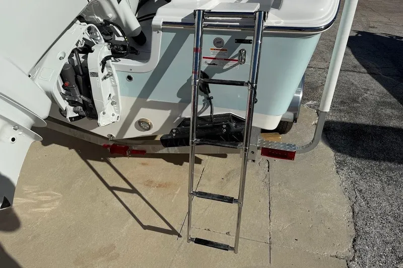 Slide: The Image of 2026 Sea Pro 240 Dual Console boat with ladder and engine details. - 11