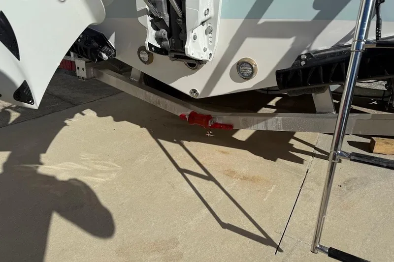 Slide: The Image of 2026 Sea Pro 240 Dual Console boat trailer hitch and ladder detail. - 13