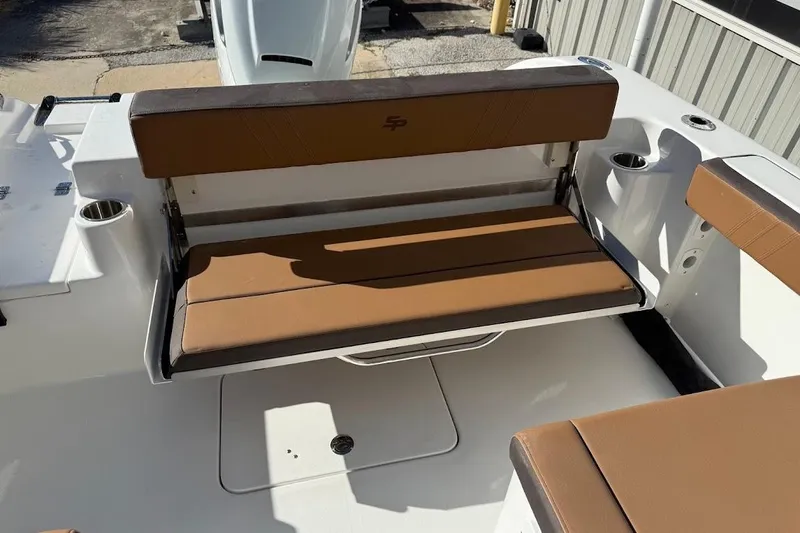 Slide: The Image of 2026 Sea Pro 240 Dual Console boat with brown seating and cup holders. - 22