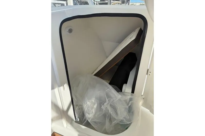 Slide: The Image of Storage compartment of 2026 Sea Pro 240 Dual Console boat, featuring interior details. - 26