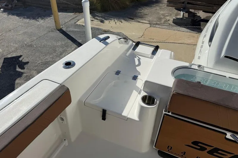 Slide: The Image of 2026 Sea Pro 240 Dual Console boat interior with seating and storage features. - 31