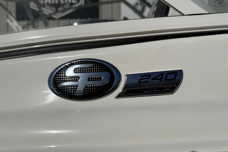 Slide: The Image of 2026 Sea Pro 240 Dual Console boat emblem close-up. - 5