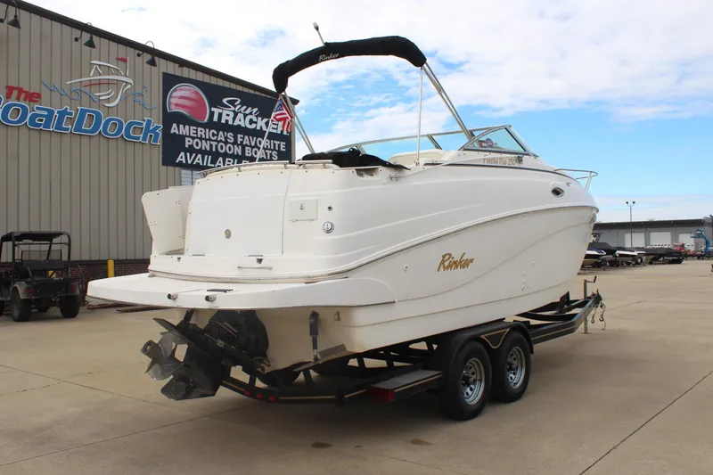 Slide: The Image of 2002 Rinker Fiesta Vee 250 boat on trailer at dealership lot. - 7