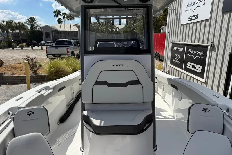 Slide: The Image of 2026 Sea Pro 242 Center Console boat interior with seating and console view. - 16