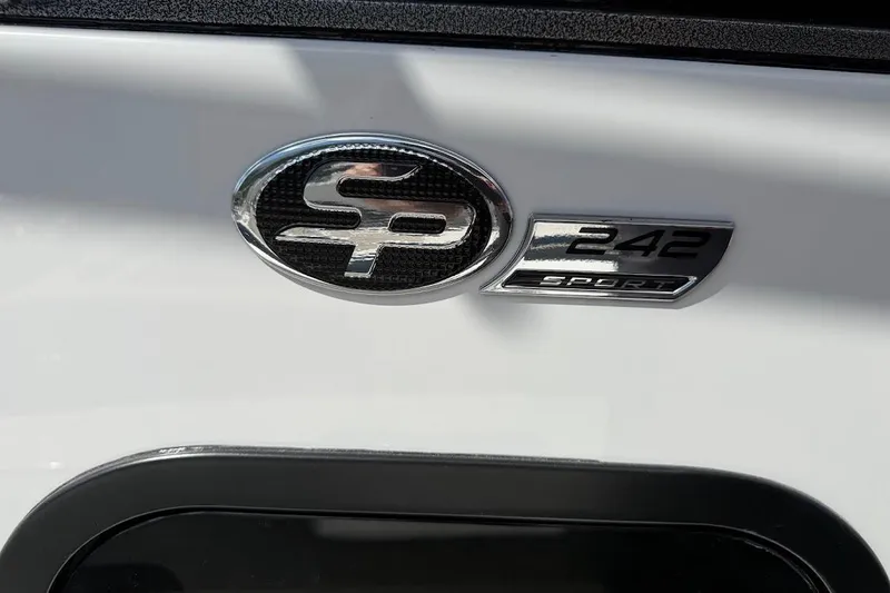 Slide: The Image of 2026 Sea Pro 242 Center Console emblem on white surface. - 18