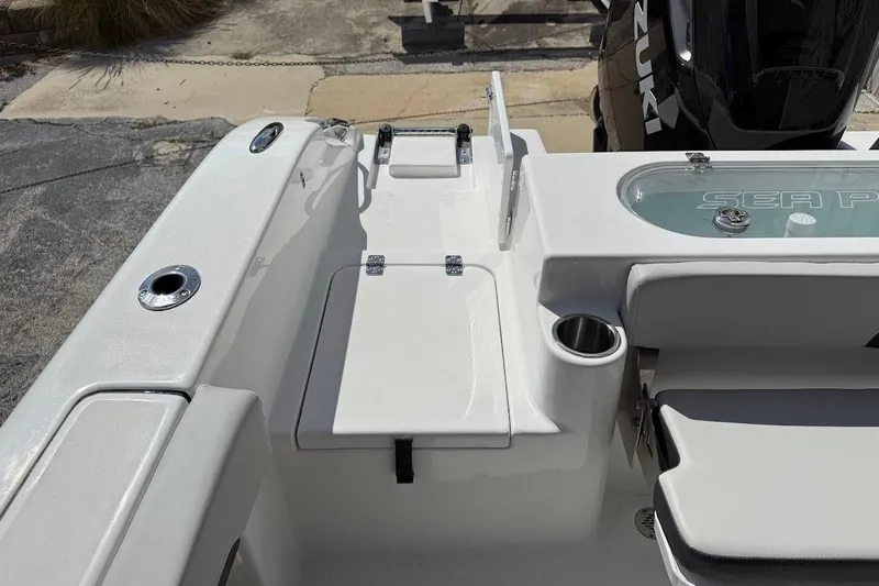 Slide: The Image of 2026 Sea Pro 242 Center Console boat interior with seating and storage features. - 23
