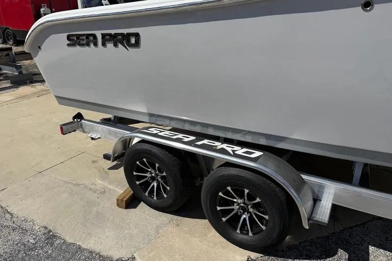 Slide: The Image of 2026 Sea Pro 242 Center Console boat on trailer, side view. - 4
