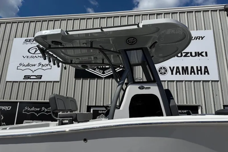 Slide: The Image of 2026 Sea Pro 242 Center Console boat displayed at dealership with Yamaha and Suzuki signage. - 5