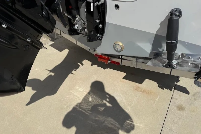 Slide: The Image of 2026 Sea Pro 242 Center Console boat engine and shadow on concrete. - 8
