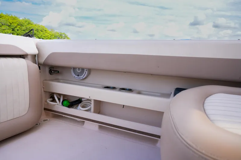 Slide: The Image of 2014 Grady-White Freedom 307 boat interior with storage compartment and seating. - 33