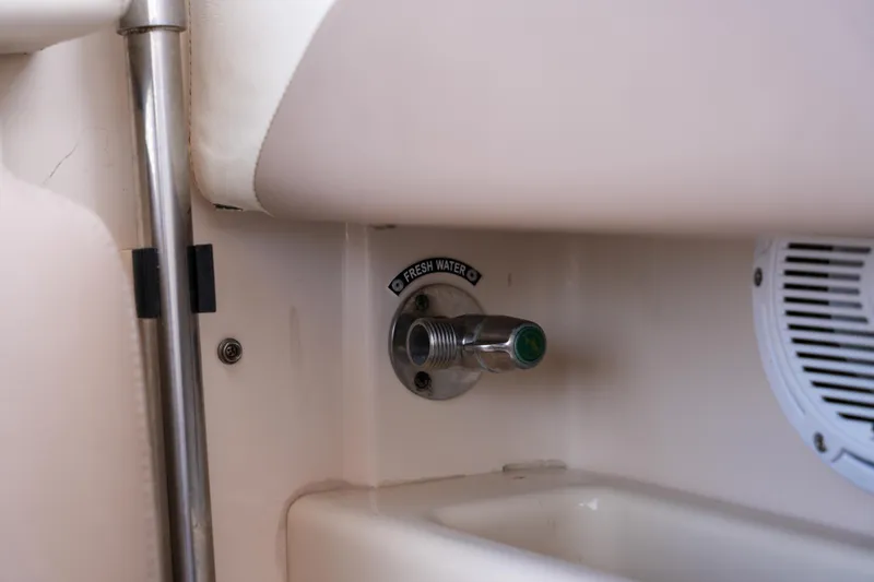Slide: The Image of 2014 Grady-White Freedom 307 boat fresh water outlet detail. - 34