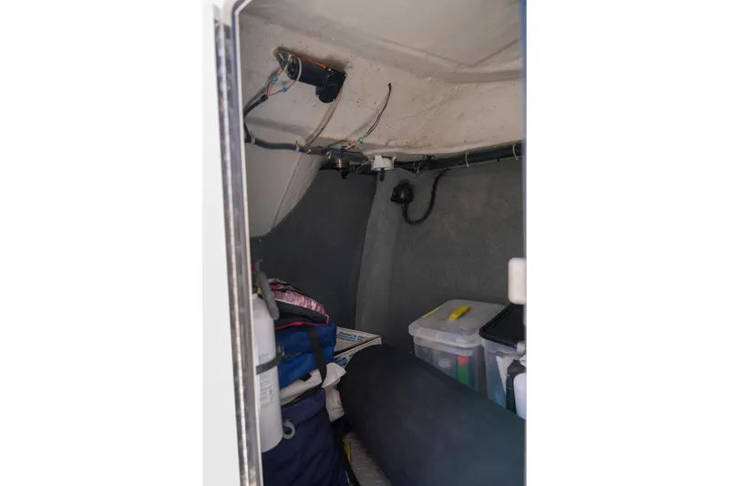 Slide: The Image of Interior storage area of 2014 Grady-White Freedom 307 boat with equipment and supplies. - 46
