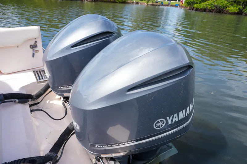Slide: The Image of Twin Yamaha outboard engines on a 2014 Grady-White Freedom 307 boat. - 58