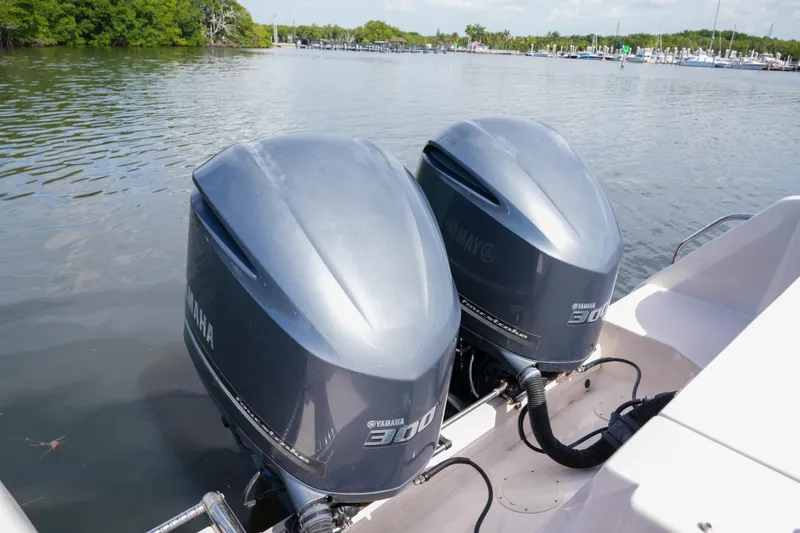 Slide: The Image of 2014 Grady-White Freedom 307 with twin Yamaha 300 engines on calm water. - 59