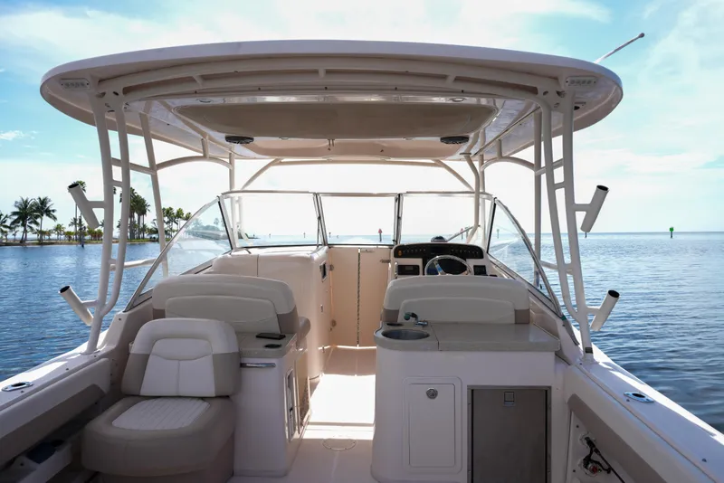 Slide: The Image of 2014 Grady-White Freedom 307 boat interior with helm, seating, and ocean view. - 7