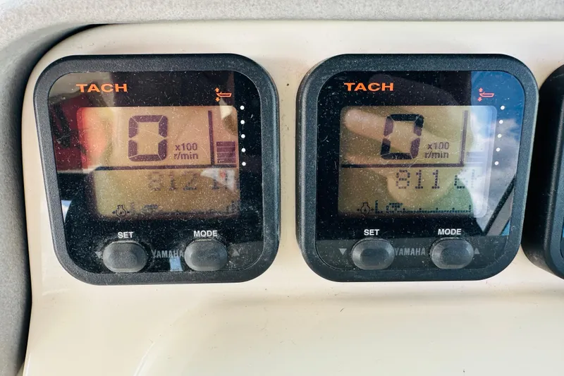 Slide: The Image of Tachometer display on 2007 Pursuit OS 285 Offshore boat dashboard, showing zero RPM. - 21