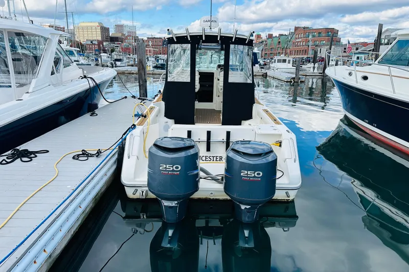 Slide: The Image of 2007 Pursuit OS 285 Offshore boat docked with twin 250 horsepower engines. - 6