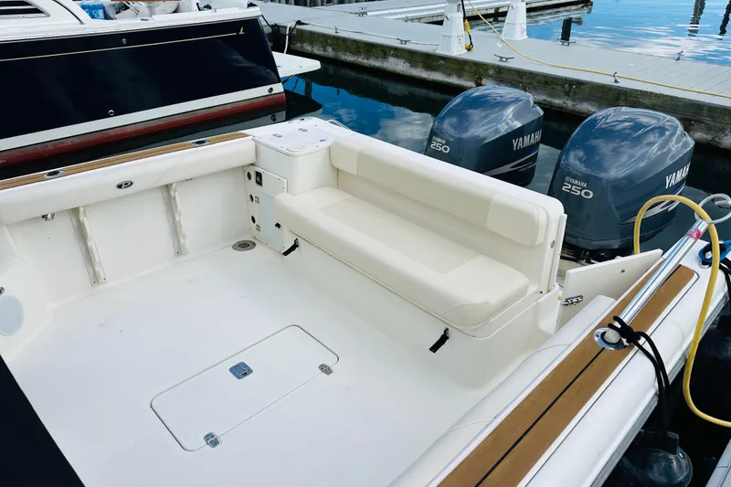 Slide: The Image of 2007 Pursuit OS 285 Offshore boat with Yamaha 250 engines at dock. - 9