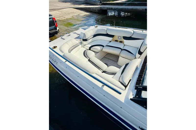 Slide: The Image of 2015 Starcraft Crossover 250 SCX OB boat with spacious seating and sleek design. - 14