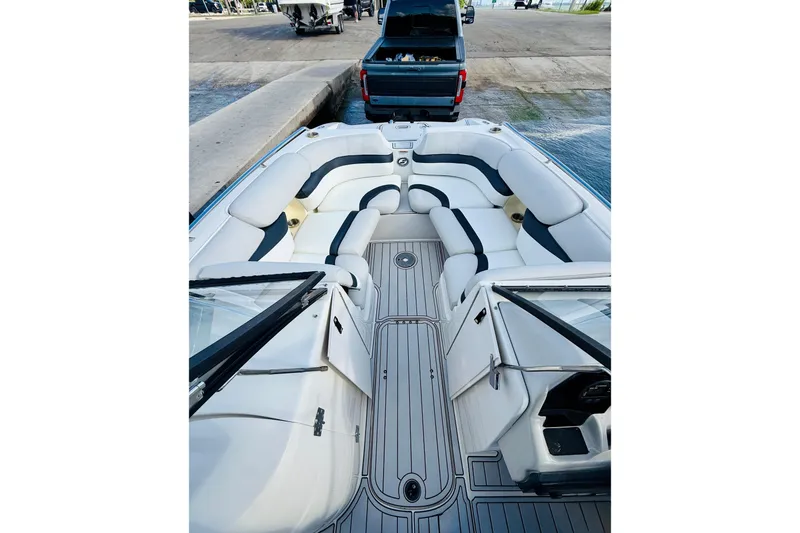 Slide: The Image of 2015 Starcraft Crossover 250 SCX OB boat interior with spacious seating and sleek design. - 15