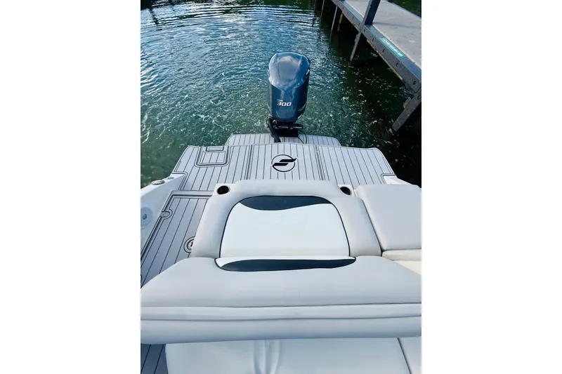 Slide: The Image of 2015 Starcraft Crossover 250 SCX OB boat with outboard motor at dock. - 17