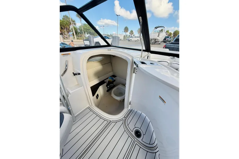 Slide: The Image of 2015 Starcraft Crossover 250 SCX OB boat interior with cabin and toilet. - 23