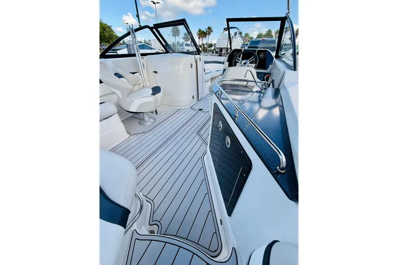 Slide: The Image of 2015 Starcraft Crossover 250 SCX OB boat interior with sleek seating and modern dashboard. - 28