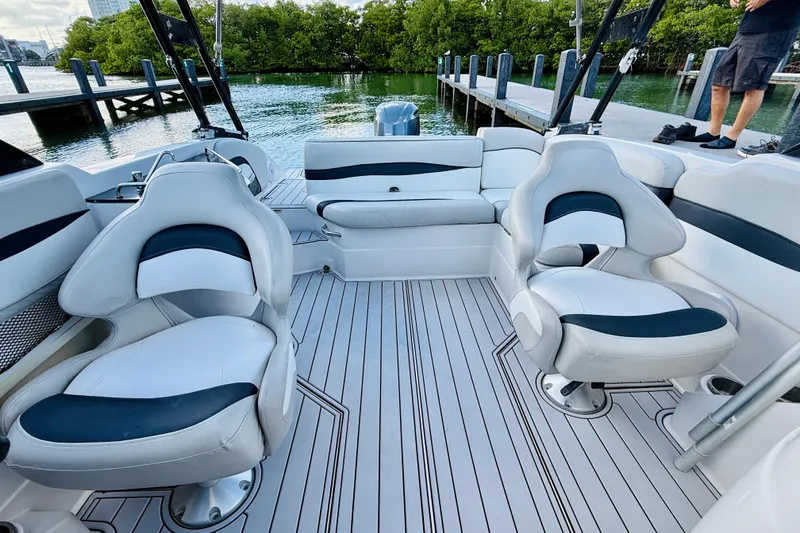 Slide: The Image of 2015 Starcraft Crossover 250 SCX OB boat interior with white seating and sleek design. - 29