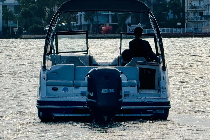 Slide: The Image of 2015 Starcraft Crossover 250 SCX OB boat on water, rear view with Yamaha outboard motor. - 39