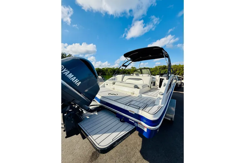 Slide: The Image of 2015 Starcraft Crossover 250 SCX OB boat with Yamaha outboard motor, under clear blue sky. - 5