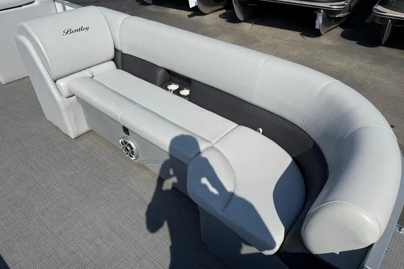 Slide: The Image of 2022 Bentley Pontoons 240 CRUISE interior with gray seating and cup holders. - 11