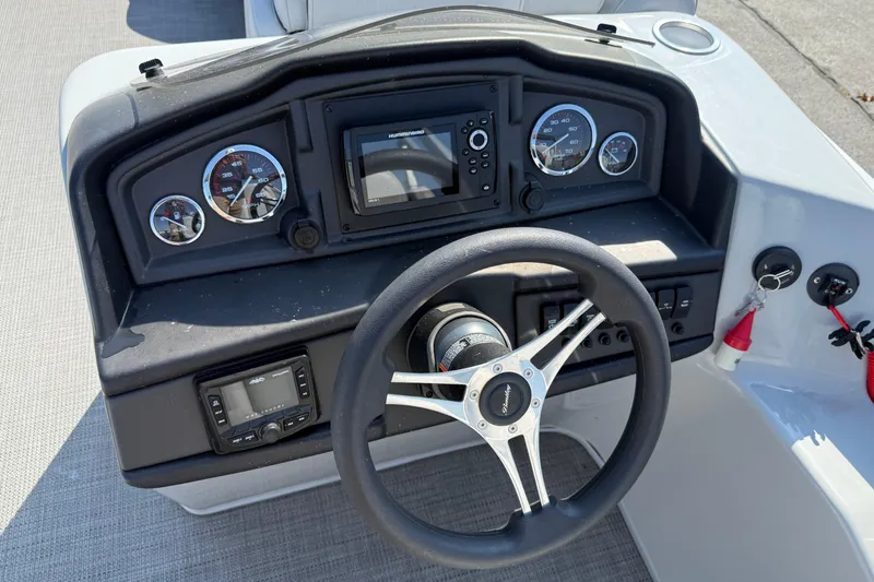 Slide: The Image of 2022 Bentley Pontoons 240 CRUISE dashboard with steering wheel and instrument panel. - 12