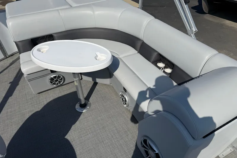 Slide: The Image of 2022 Bentley Pontoons 240 CRUISE interior with gray seating and round table. - 16