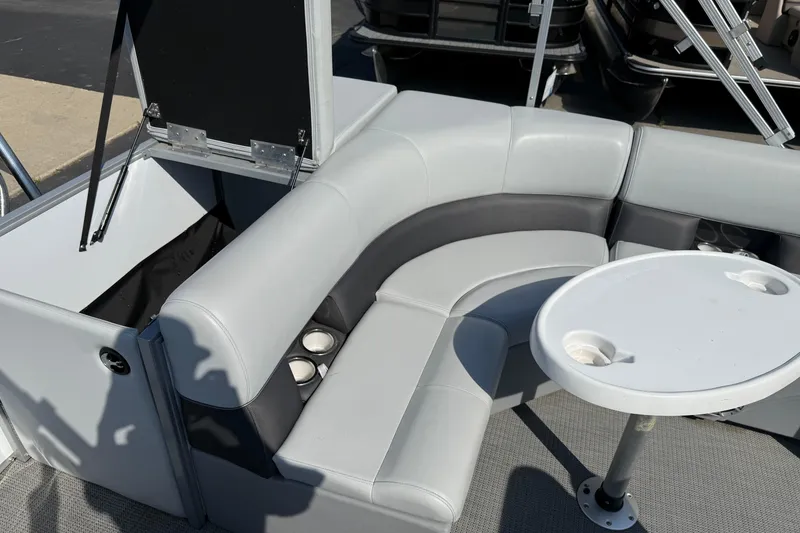Slide: The Image of 2022 Bentley Pontoons 240 CRUISE interior with gray seating and round table. - 18