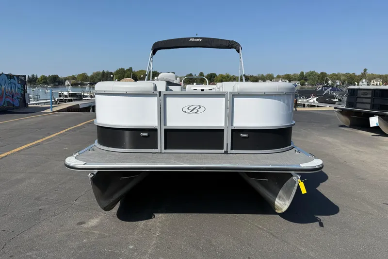 Slide: The Image of 2022 Bentley Pontoons 240 CRUISE pontoon boat docked at marina, front view. - 2