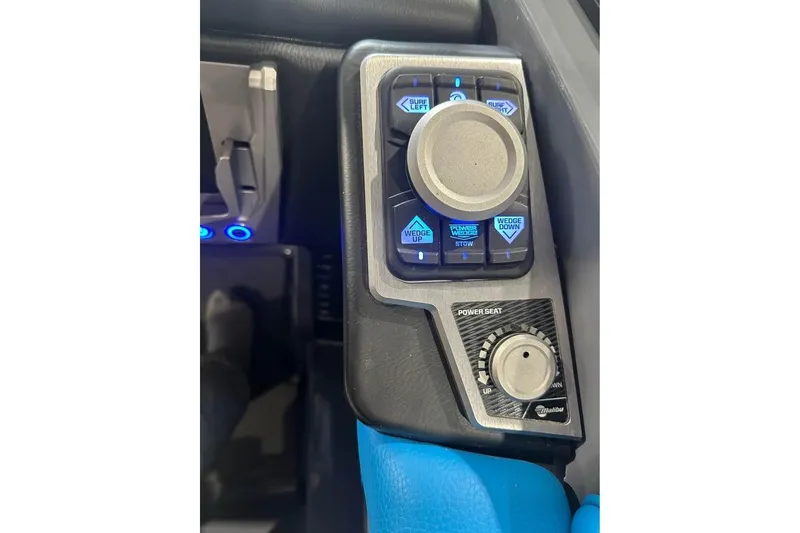 Slide: The Image of 2022 Malibu M220 control panel with illuminated buttons and power seat adjustment knob. - 11