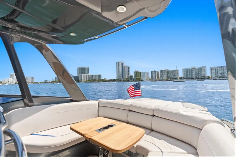 Slide: The Image of Luxurious 2020 Princess R35 yacht interior with city skyline view and American flag. - 12