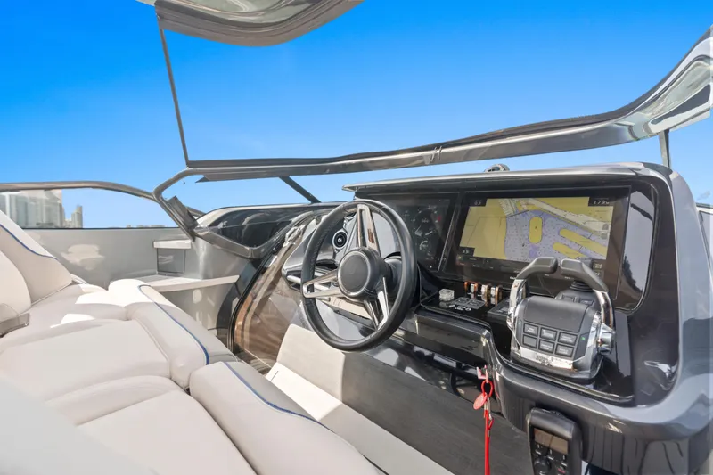 Slide: The Image of Luxury yacht cockpit of 2020 Princess R35 with navigation display and steering wheel. - 18