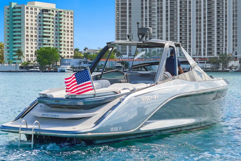 Slide: The Image of Luxury 2020 Princess R35 yacht "Mischief" in Miami waters, with American flag. - 2