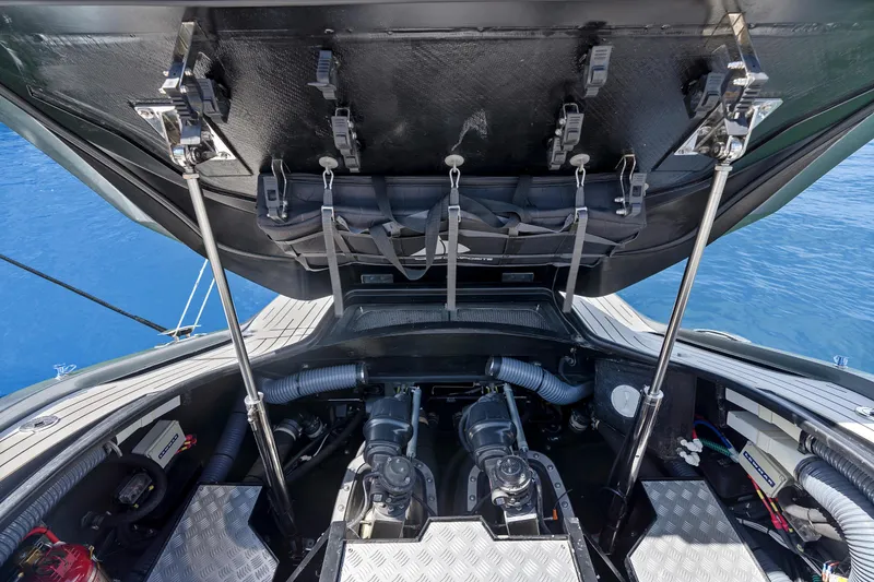 Slide: The Image of Engine compartment of a 2020 Princess R35 yacht, showcasing mechanical components and storage. - 30