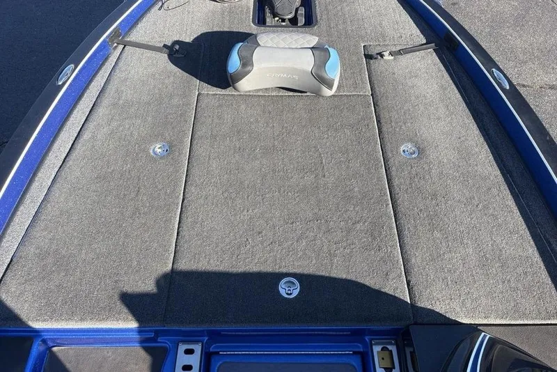 Slide: The Image of 2021 Caymas CX20 boat deck with gray carpet and storage compartments. - 14