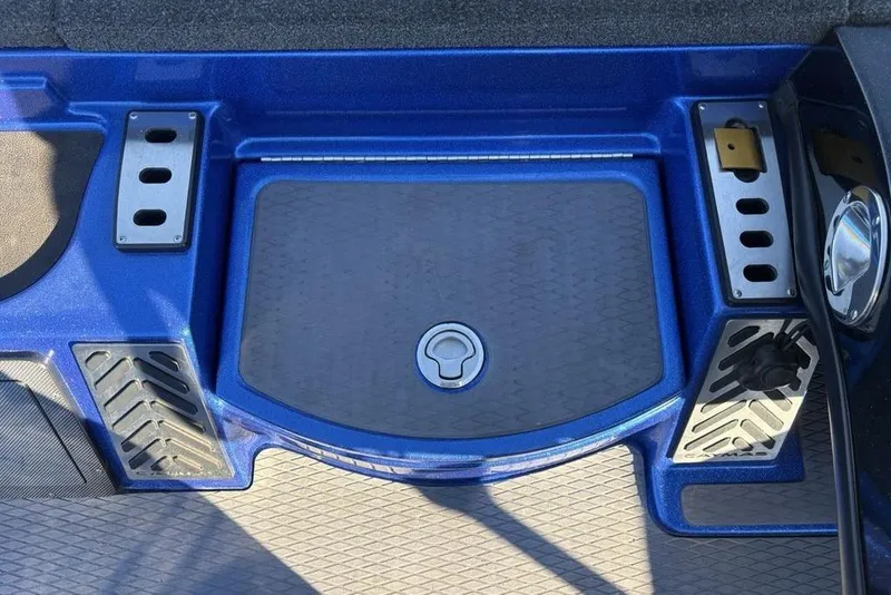 Slide: The Image of 2021 Caymas CX20 boat deck with storage compartment and blue accents. - 18