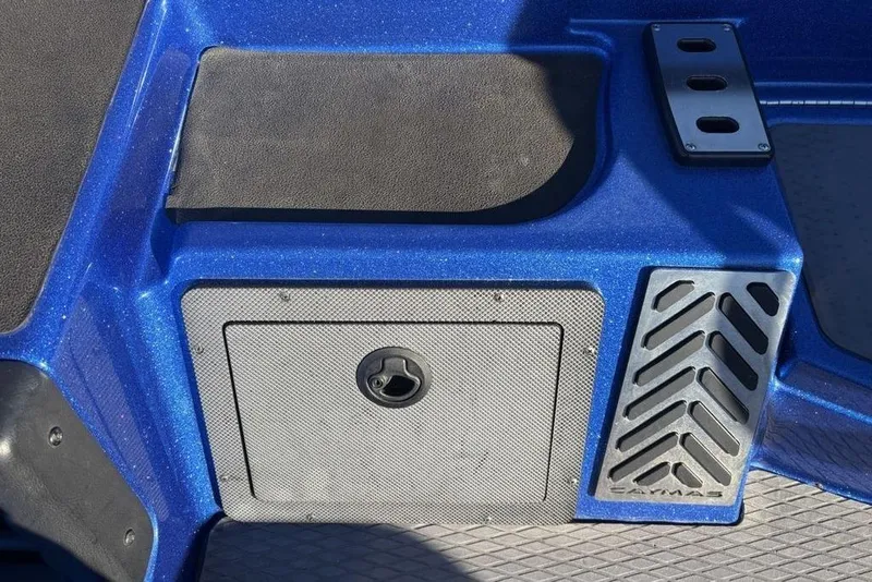 Slide: The Image of 2021 Caymas CX20 boat deck with storage compartment and textured blue finish. - 20