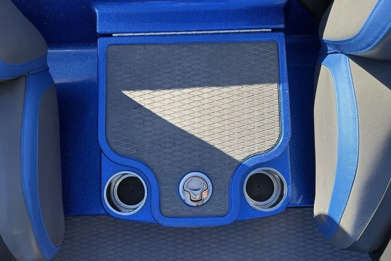 Slide: The Image of 2021 Caymas CX20 boat interior with blue and gray seating and cup holders. - 21
