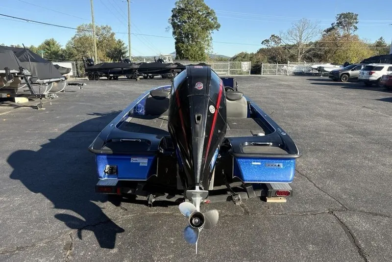 Slide: The Image of 2021 Caymas CX20 boat with outboard motor in a parking lot. - 3