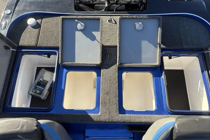 Slide: The Image of 2021 Caymas CX20 boat storage compartments with open lids, showcasing spacious interior. - 30