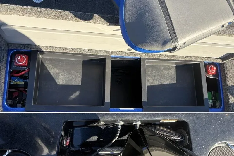 Slide: The Image of 2021 Caymas CX20 boat storage compartments with trolling motor switches visible. - 35