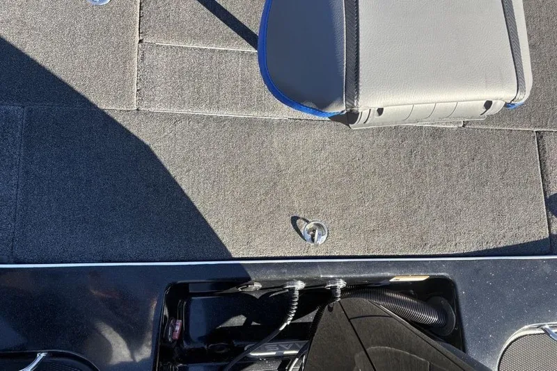 Slide: The Image of 2021 Caymas CX20 boat interior with gray carpet and seat detail. - 36