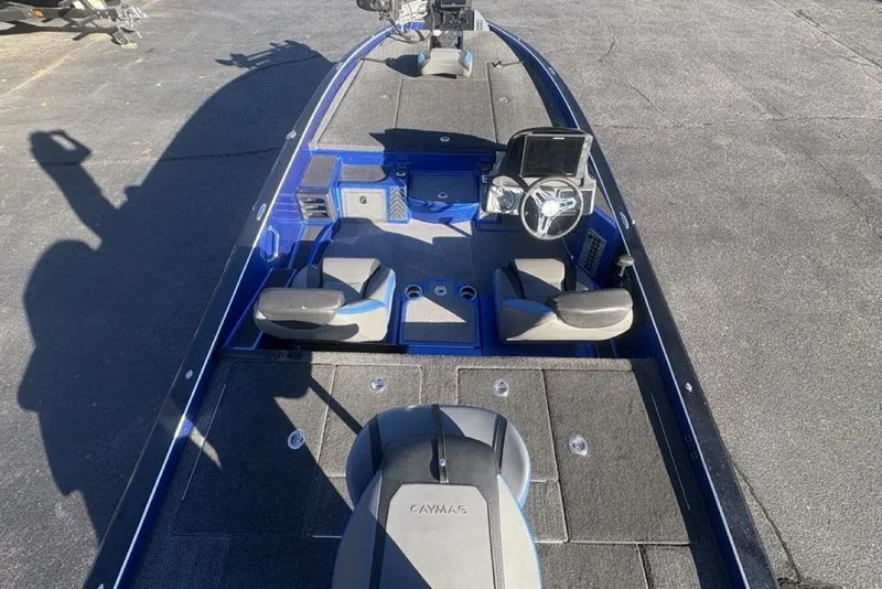 Slide: The Image of 2021 Caymas CX20 boat interior with steering console and seating, featuring a sleek design. - 39
