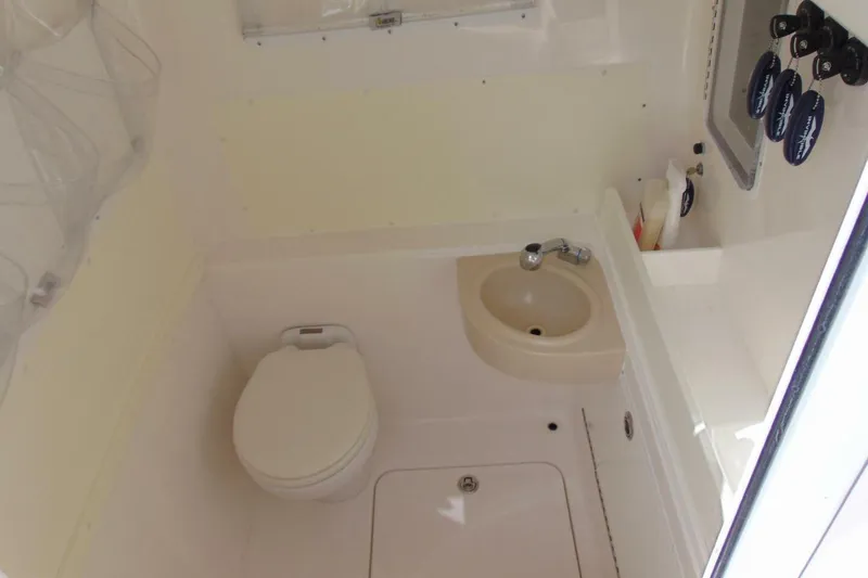 Slide: The Image of Compact bathroom in 2020 Invincible 36 Open boat with toilet and sink. - 13